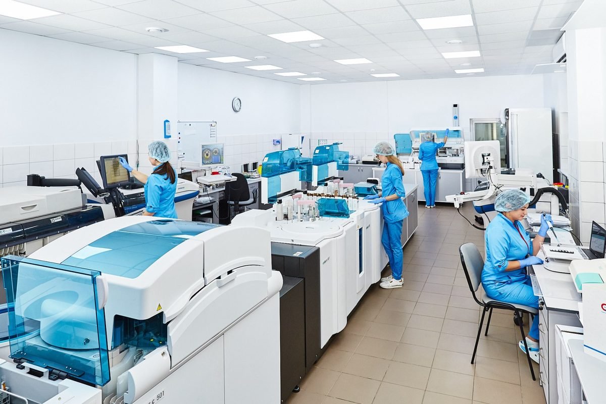 A group of scientists working together in a laboratory.